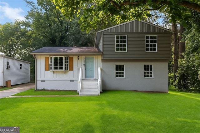 6192 Holiday Blvd, Forest Park, GA 30297 - split level home featuring a front lawn, crawl space, and board and batten siding