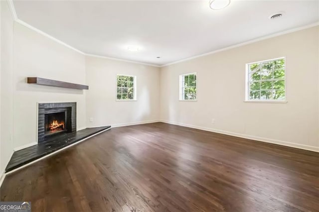 6192 Holiday Blvd, Forest Park, GA 30297 - unfurnished living room with crown molding, wood finished floors, and a lit fireplace