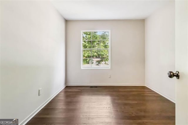 6192 Holiday Blvd, Forest Park, GA 30297 - unfurnished room with wood finished floors and baseboards