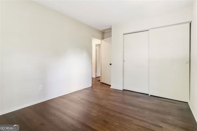 6192 Holiday Blvd, Forest Park, GA 30297 - unfurnished bedroom featuring wood finished floors and a closet