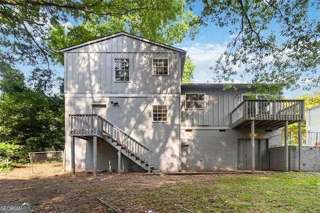 6192 Holiday Blvd, Forest Park, GA 30297 - back of house featuring stairway, a deck, and board and batten siding