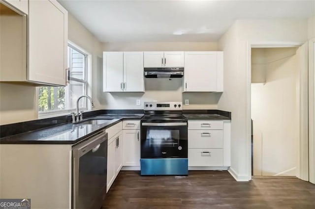 6192 Holiday Blvd, Forest Park, GA 30297 - kitchen featuring appliances with stainless steel finishes, range hood, dark wood finished floors, dark countertops, and white cabinets