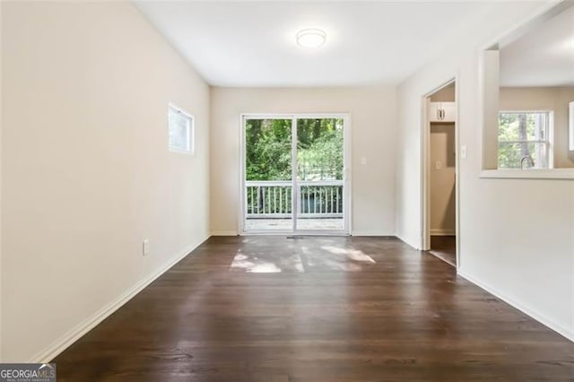 6192 Holiday Blvd, Forest Park, GA 30297 - empty room featuring dark wood-type flooring and baseboards