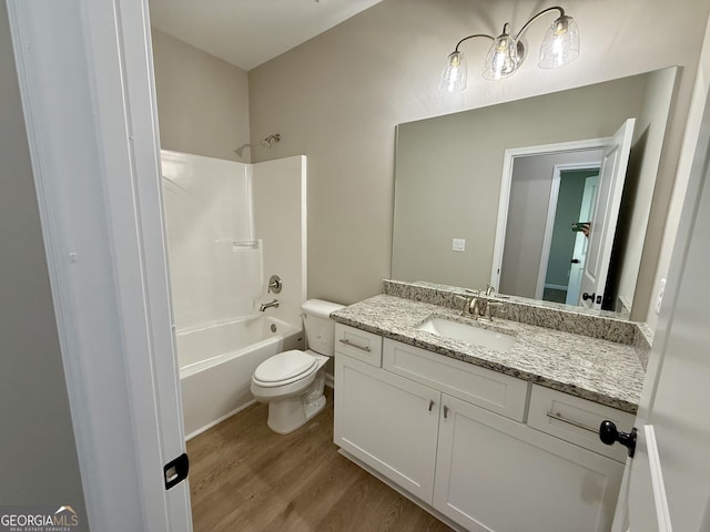 143 Roberts Quarters Rd, Concord, GA 30206 - full bath featuring toilet, wood finished floors, vanity, and bathing tub / shower combination