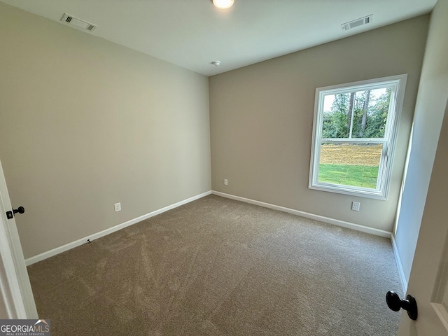 143 Roberts Quarters Rd, Concord, GA 30206 - empty room featuring carpet floors and baseboards