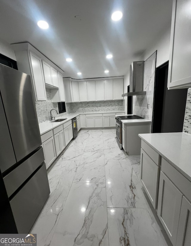 782 Wimbish Rd, Macon, GA 31210 - kitchen with stainless steel appliances, a sink, recessed lighting, light marble finish floors, and wall chimney range hood
