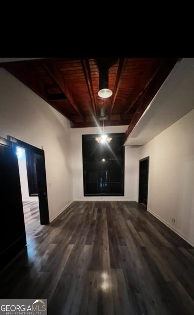 782 Wimbish Rd, Macon, GA 31210 - unfurnished living room with baseboards, wood finished floors, and wooden ceiling with exposed beams