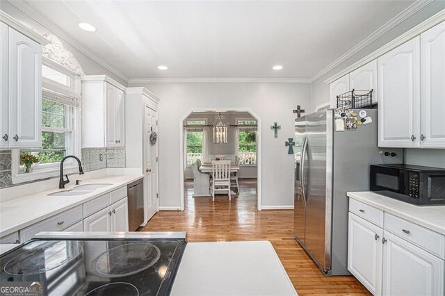 83 Shipp, Hiram, GA 30141 - kitchen with stainless steel appliances, plenty of natural light, white cabinetry, crown molding, and recessed lighting