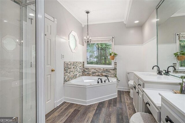 83 Shipp, Hiram, GA 30141 - bathroom with a stall shower, double vanity, a spacious closet, wainscoting, and wood finished floors