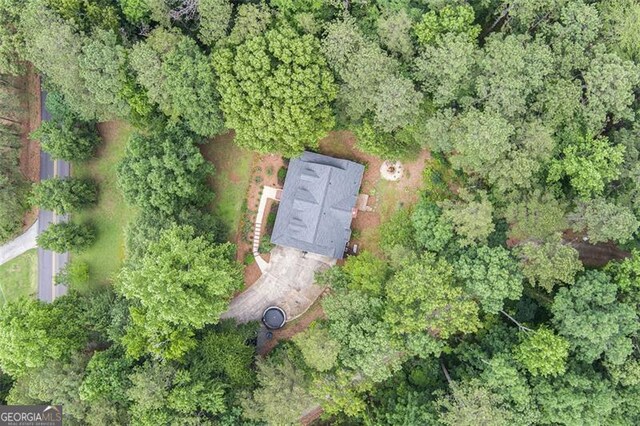 83 Shipp, Hiram, GA 30141 - rear view of property with an outdoor fire pit, a sunroom, a shingled roof, and a chimney