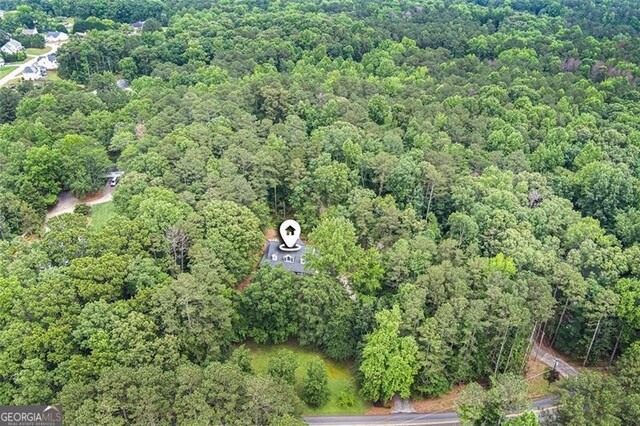 83 Shipp, Hiram, GA 30141 - aerial view of property and surrounding area with a heavily wooded area