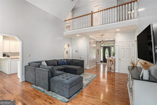 83 Shipp, Hiram, GA 30141 - living room featuring high vaulted ceiling, light wood-style flooring, and arched walkways