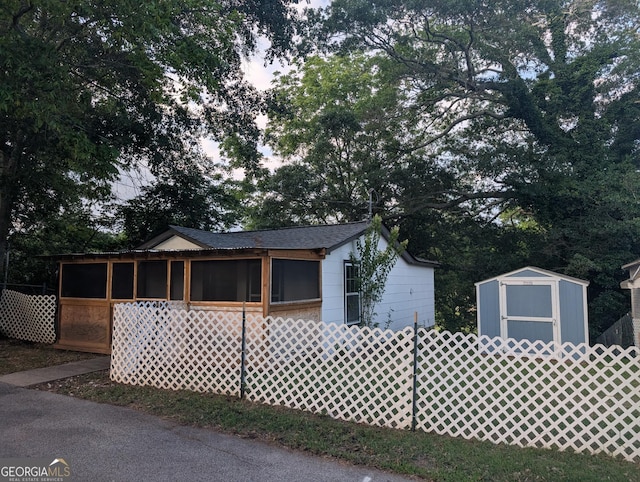 128 Branch St, Toccoa, GA 30577 - view of front of property featuring a sunroom and roof with shingles
