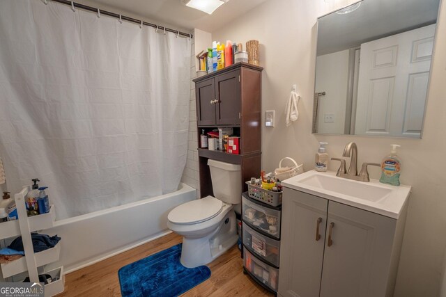 128 Branch St, Toccoa, GA 30577 - full bath featuring wood finished floors, vanity, toilet, and shower / tub combo with curtain
