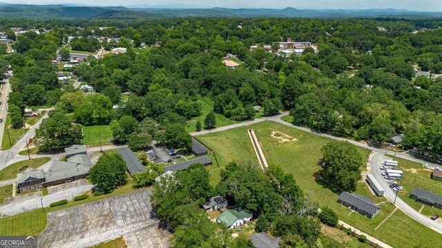 128 Branch St, Toccoa, GA 30577 - aerial view of property and surrounding area featuring a mountainous background and a forest