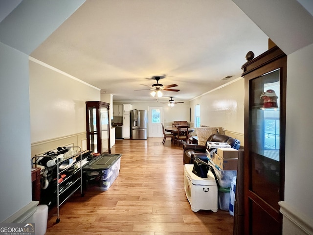 2618 Ga Highway 86, Adrian, GA 31002 - living area featuring crown molding, a ceiling fan, and light wood-style flooring