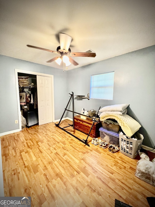 2618 Ga Highway 86, Adrian, GA 31002 - workout area featuring a ceiling fan, wood finished floors, and baseboards