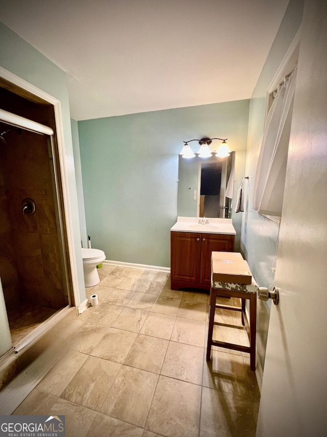 2618 Ga Highway 86, Adrian, GA 31002 - full bath featuring vanity, a stall shower, toilet, baseboards, and tile patterned floors