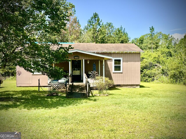 2618 Ga Highway 86, Adrian, GA 31002 - view of front facade with a front yard and roof with shingles