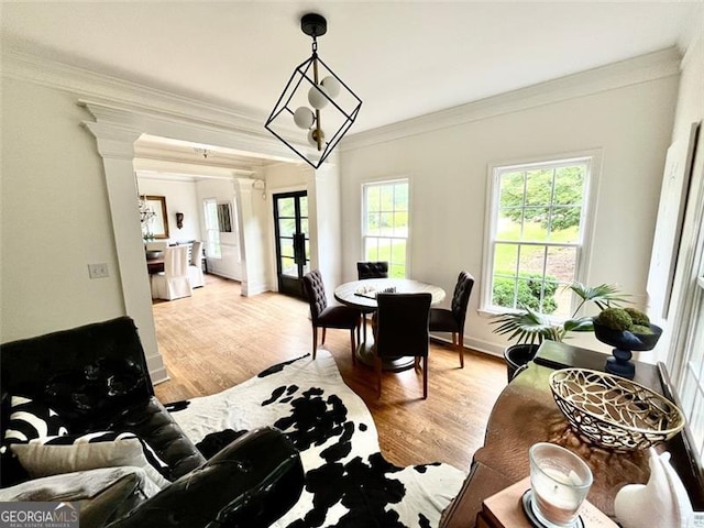 8525 Anchor On Lanier Ct, Gainesville, GA 30506 - dining space with decorative columns, ornamental molding, light wood-type flooring, and baseboards
