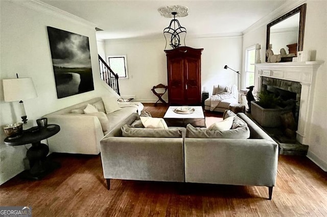 8525 Anchor On Lanier Ct, Gainesville, GA 30506 - living room with crown molding, wood finished floors, healthy amount of natural light, a tiled fireplace, and stairs