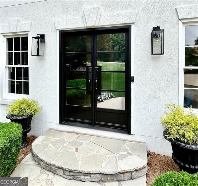 8525 Anchor On Lanier Ct, Gainesville, GA 30506 - property entrance featuring french doors and stucco siding