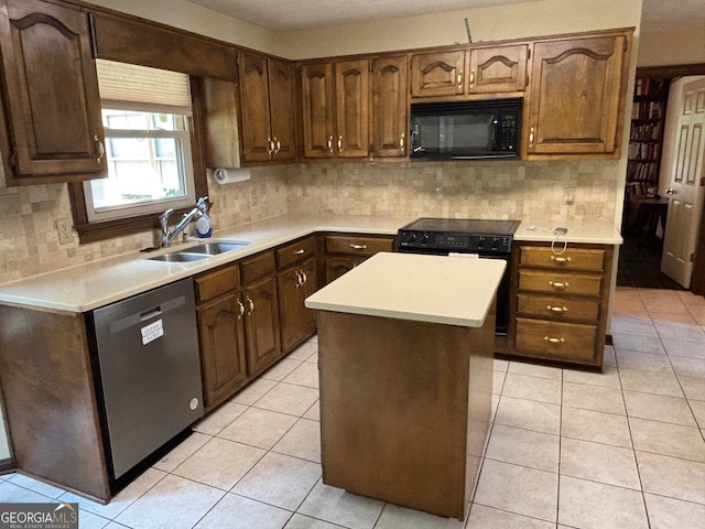 404 Windsor Way, Peachtree City, GA 30269 - kitchen with black appliances, a sink, light countertops, and tasteful backsplash