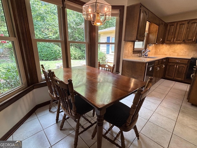 404 Windsor Way, Peachtree City, GA 30269 - dining room with light tile patterned floors, a chandelier, and baseboards