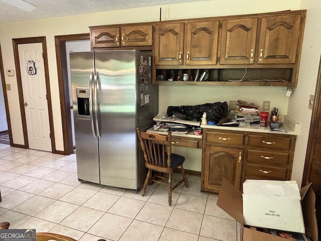 404 Windsor Way, Peachtree City, GA 30269 - kitchen with stainless steel refrigerator with ice dispenser, light tile patterned floors, light countertops, and open shelves