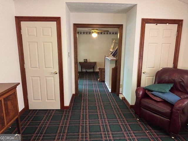 404 Windsor Way, Peachtree City, GA 30269 - corridor featuring dark colored carpet and baseboards