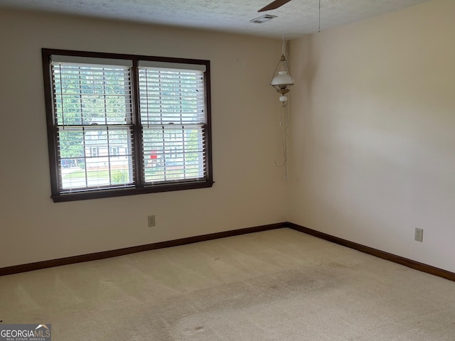 404 Windsor Way, Peachtree City, GA 30269 - empty room featuring light carpet, baseboards, a ceiling fan, and a textured ceiling