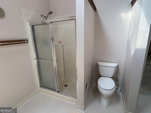 404 Windsor Way, Peachtree City, GA 30269 - full bath featuring a stall shower, baseboards, tile patterned flooring, and toilet