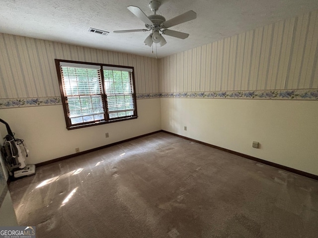 404 Windsor Way, Peachtree City, GA 30269 - carpeted spare room with wallpapered walls, ceiling fan, baseboards, and a textured ceiling