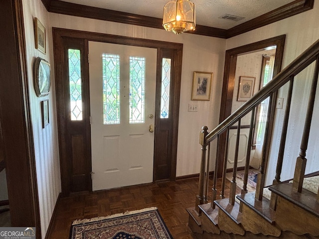 404 Windsor Way, Peachtree City, GA 30269 - entrance foyer with stairs, crown molding, plenty of natural light, a textured ceiling, and a chandelier