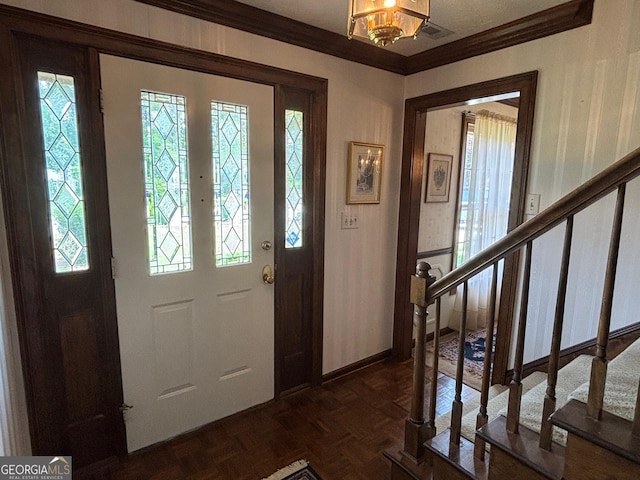 404 Windsor Way, Peachtree City, GA 30269 - entrance foyer featuring crown molding, plenty of natural light, stairway, and a chandelier