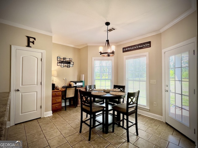 511 Live Oak Way, Dublin, GA 31021 - dining area with crown molding, baseboards, a chandelier, and light tile patterned floors