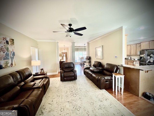 511 Live Oak Way, Dublin, GA 31021 - living area with ceiling fan, wood finished floors, decorative columns, and crown molding