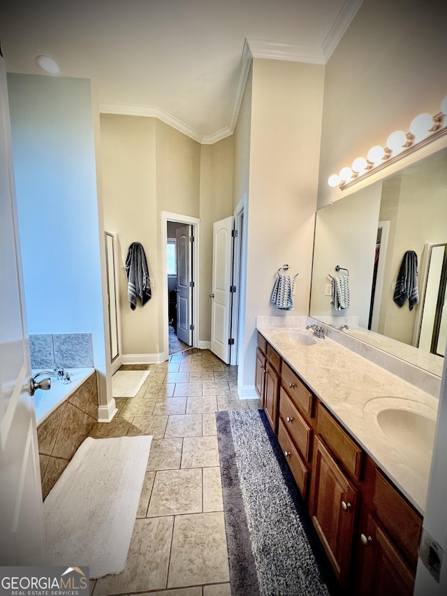 511 Live Oak Way, Dublin, GA 31021 - full bath featuring crown molding, baseboards, double vanity, a bath, and a high ceiling