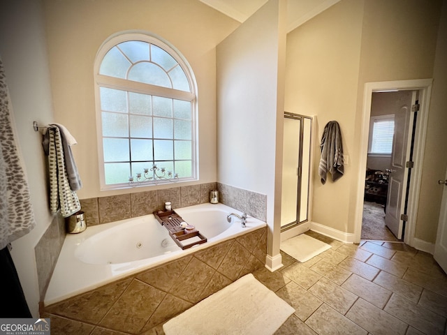 511 Live Oak Way, Dublin, GA 31021 - bathroom with a whirlpool tub, a stall shower, and baseboards