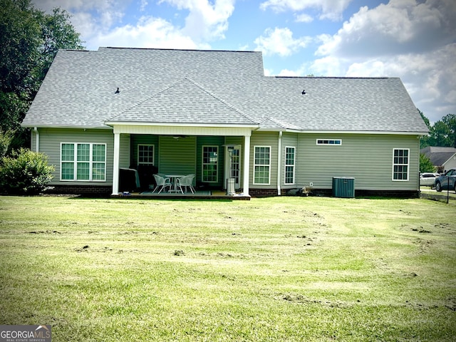 511 Live Oak Way, Dublin, GA 31021 - rear view of house featuring central AC, a shingled roof, a lawn, and a patio area