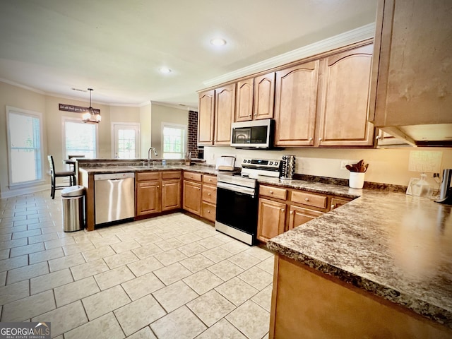 511 Live Oak Way, Dublin, GA 31021 - kitchen with stainless steel appliances, a peninsula, crown molding, a sink, and recessed lighting