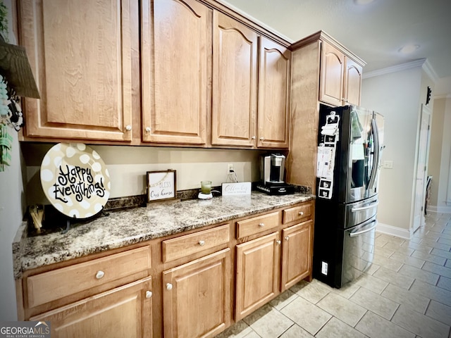 511 Live Oak Way, Dublin, GA 31021 - kitchen with stainless steel refrigerator with ice dispenser, ornamental molding, light tile patterned floors, light stone countertops, and baseboards