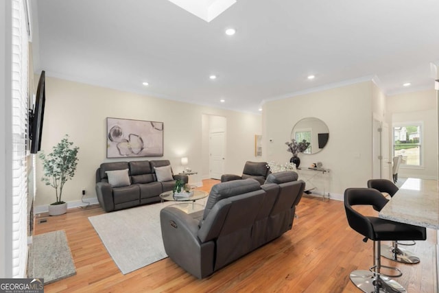 4457 Equity Ct, Ellenwood, GA 30294 - living area with a skylight, light wood-type flooring, baseboards, ornamental molding, and recessed lighting