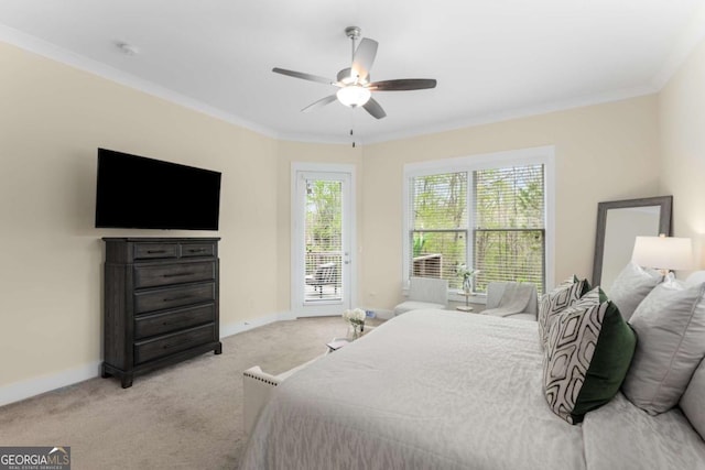 4457 Equity Ct, Ellenwood, GA 30294 - carpeted bedroom featuring access to exterior, baseboards, ornamental molding, and a ceiling fan