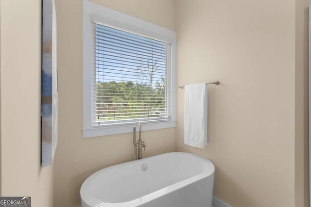 4457 Equity Ct, Ellenwood, GA 30294 - full bath with a freestanding bath