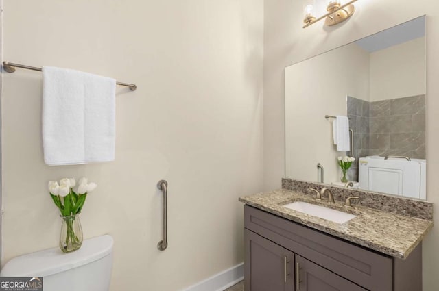 4457 Equity Ct, Ellenwood, GA 30294 - full bath with toilet, vanity, baseboards, and a shower