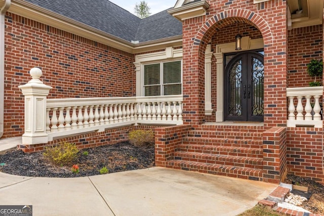 4457 Equity Ct, Ellenwood, GA 30294 - property entrance featuring brick siding and roof with shingles