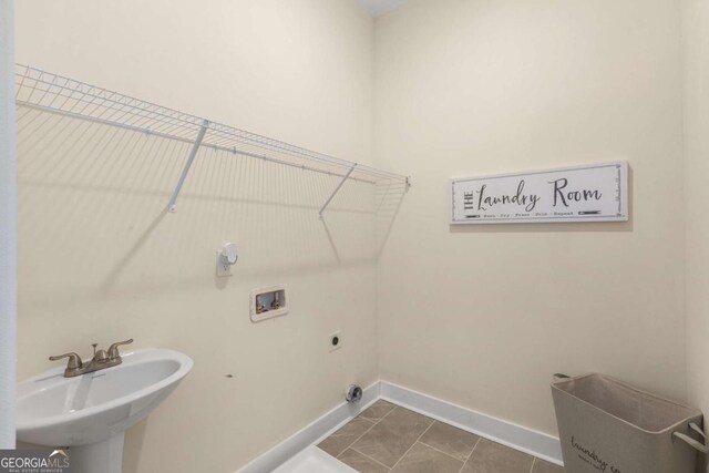 4457 Equity Ct, Ellenwood, GA 30294 - laundry room featuring washer hookup, electric dryer hookup, and baseboards