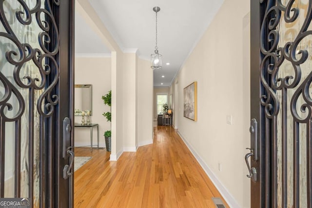 4457 Equity Ct, Ellenwood, GA 30294 - entryway featuring light wood-style floors, baseboards, ornamental molding, and recessed lighting