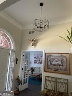 3955 Sweetwater Pkwy, Ellenwood, GA 30294 - entrance foyer featuring a chandelier and crown molding